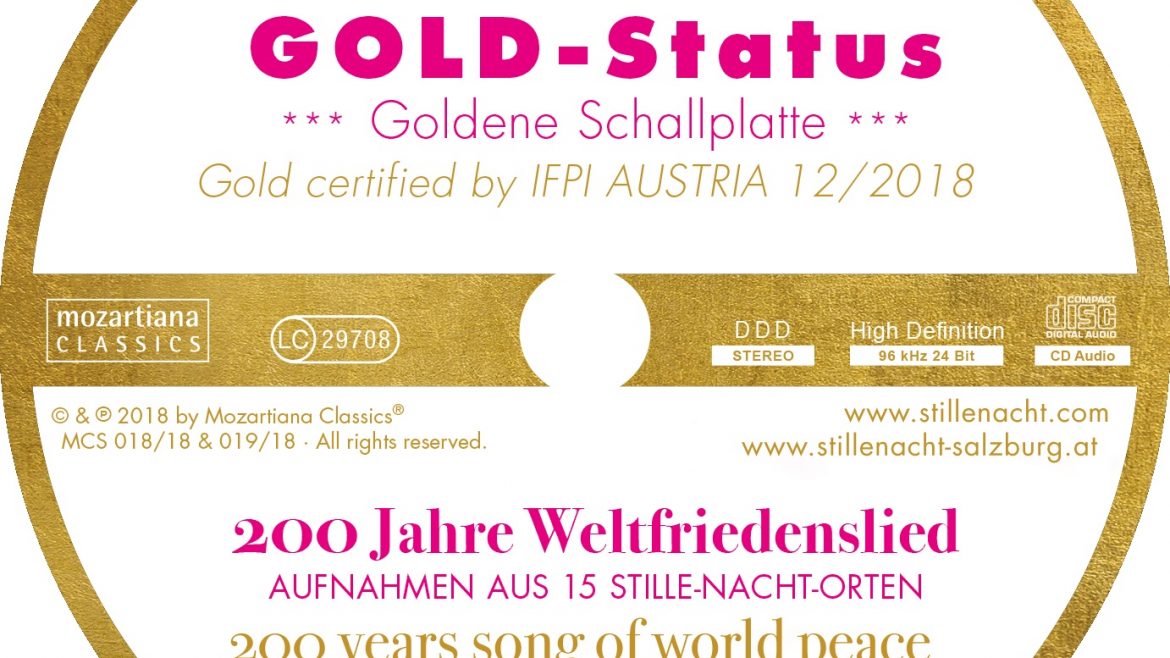 Eine runde goldene Schallplattenplakette mit GOLD-Status und 200 Jahre Lied vom Weltfrieden in Deutsch und Englisch.