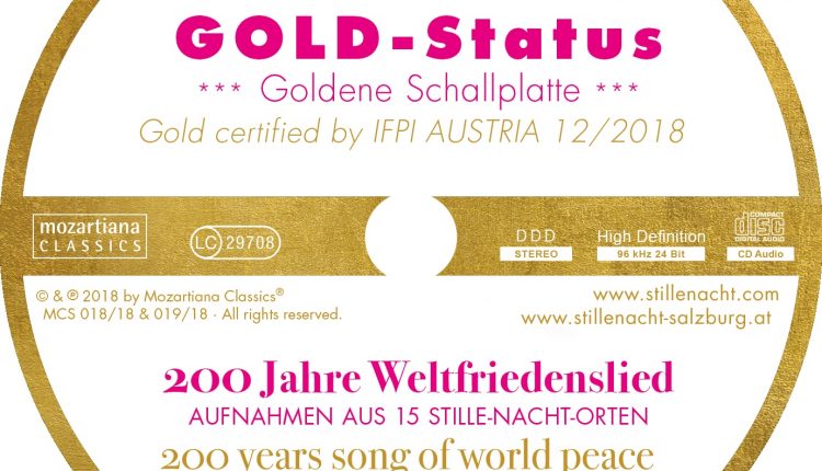 Eine runde goldene Schallplattenplakette mit GOLD-Status und 200 Jahre Lied vom Weltfrieden in Deutsch und Englisch.