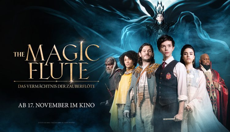Eine Gruppe von Personen in Fantasiekostümen steht vor einem dunklen, mystischen Hintergrund mit dem Titel Die Zauberflöte.
